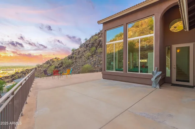 a view of a terrace with a table and chairs