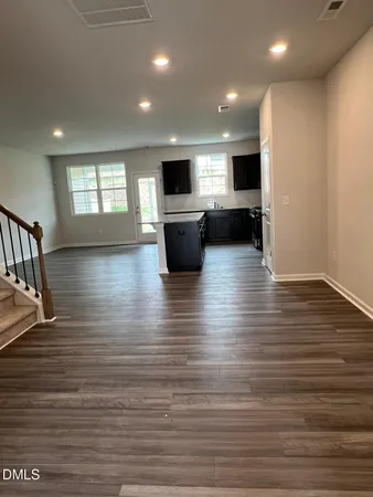 a view of kitchen with furniture and wooden floor