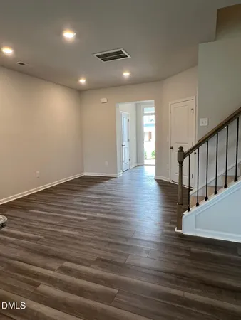 a view of an entryway with wooden floors