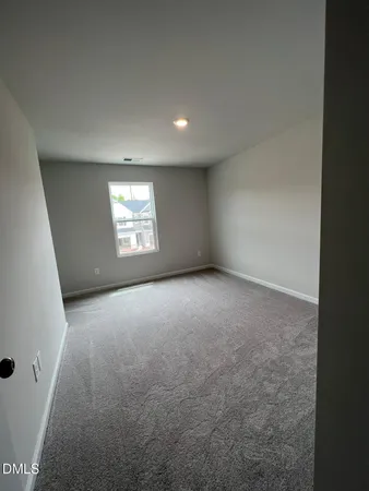 an empty room with windows and yard