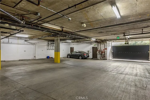 a view of parking garage with cars