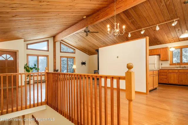 a view of a porch with wooden floor
