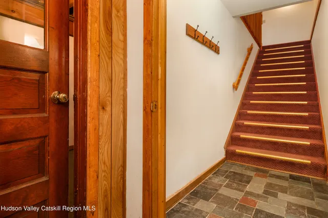 a view of walk in closet with clothes