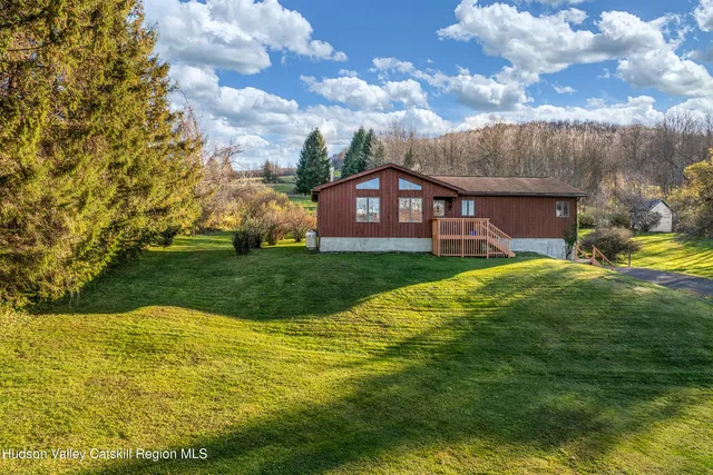a view of a house with a big yard