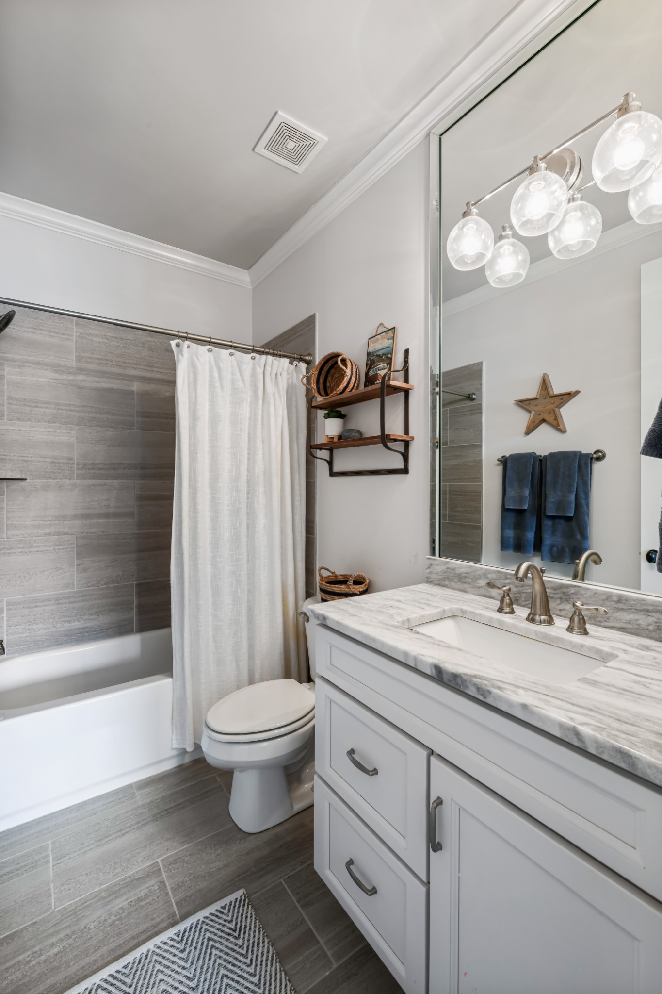 3577 Creamery Brg Road Thompson's Station, TN 37179 - Photo 29 of 42 a bathroom with a granite countertop sink a toilet a mirror a bathtub and shower