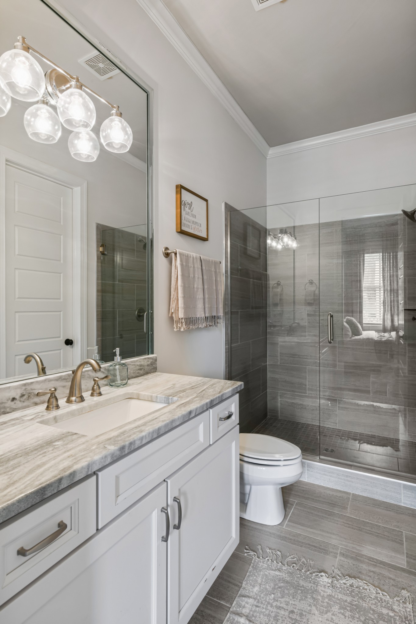 3577 Creamery Brg Road Thompson's Station, TN 37179 - Photo 30 of 42 a bathroom with a sink a toilet a mirror a vanity and shower
