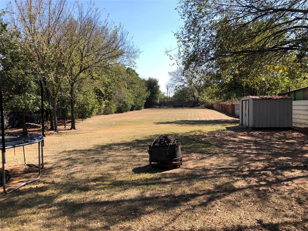 8430 Retta Mansfield Road Mansfield, TX 76063 - Photo 17 of 17 a outdoor view of a backyard