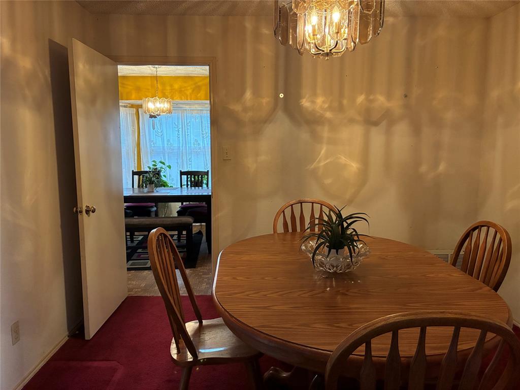 8430 Retta Mansfield Road Mansfield, TX 76063 - Photo 6 of 17 a view of a dining room with furniture and wooden floor
