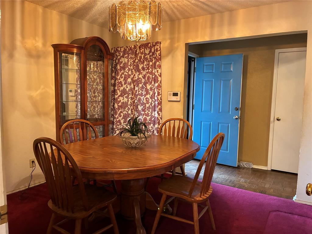 8430 Retta Mansfield Road Mansfield, TX 76063 - Photo 7 of 17 a view of a dining room with furniture and wooden floor