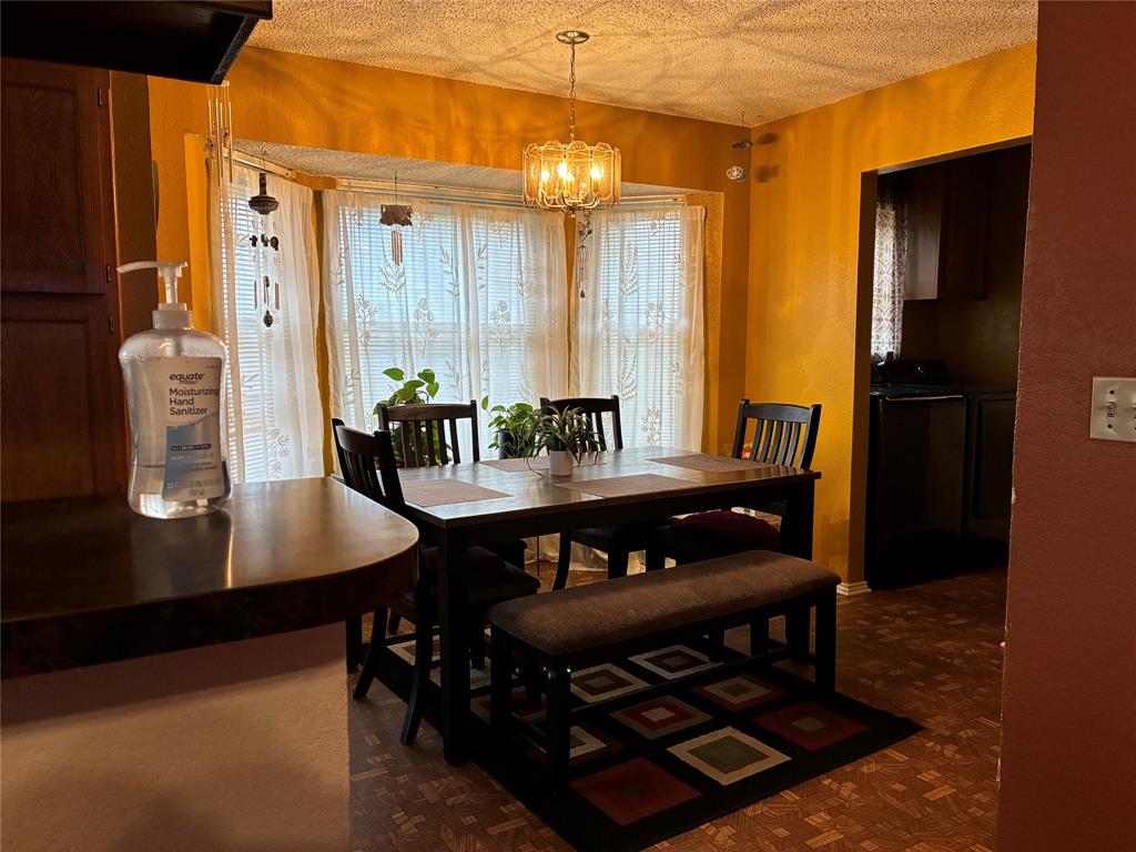 8430 Retta Mansfield Road Mansfield, TX 76063 - Photo 10 of 17 a view of a dining room with furniture and window