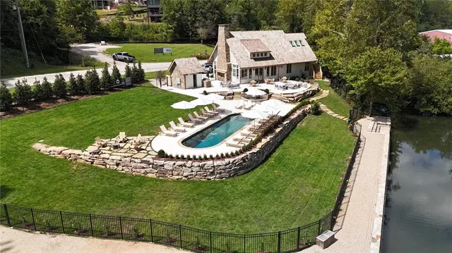 an aerial view of a house having yard