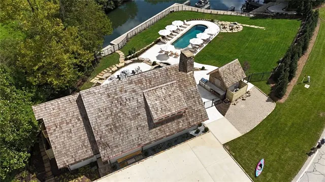 a view of a big yard with lots of green space