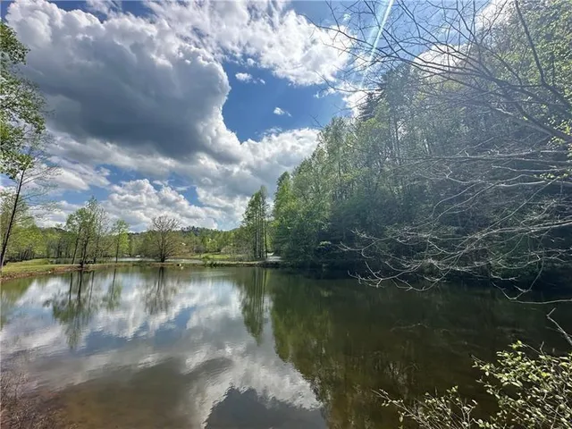 a view of a lake in middle of the house