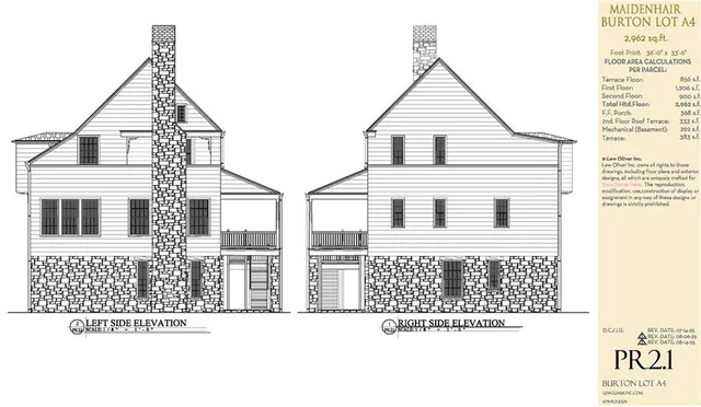 a view of a yard with potted plants and a large tree