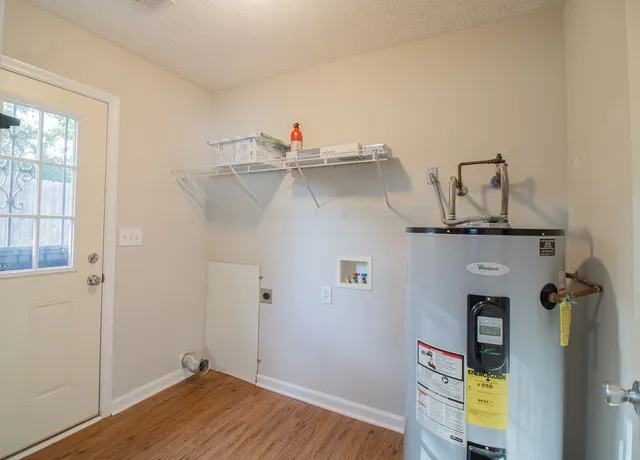 a view of a room with wooden floor and closet