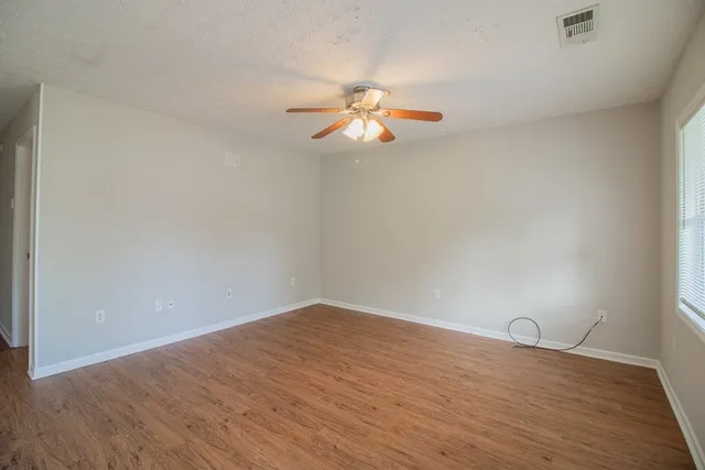 a view of room with wooden floor