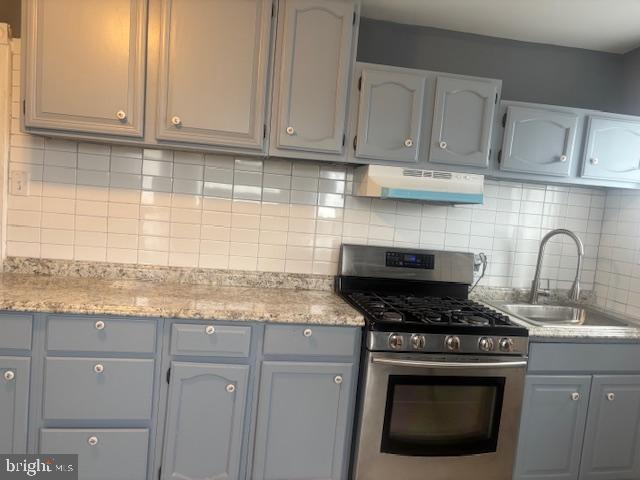 5630 Walnut Street, Unit 2 Philadelphia, PA 19139 - Photo 21 of 28 a kitchen with granite countertop white cabinets and appliances