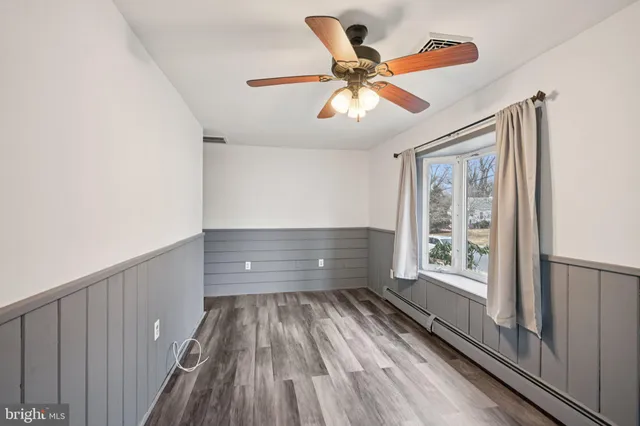 a view of room window and wooden floor