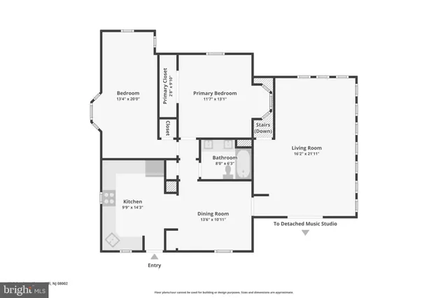 a picture of a bathroom with a white wall and a picture