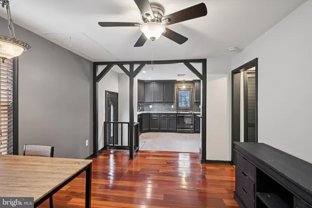 a open kitchen with stainless steel appliances granite countertop a stove and a refrigerator