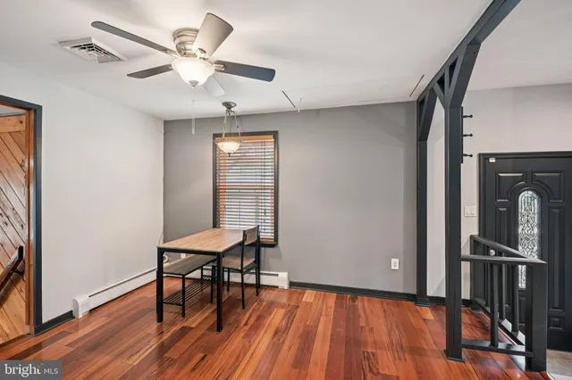 a view of a livingroom with furniture and a window