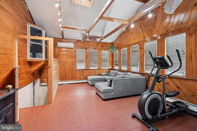 a view of gym equipment and windows