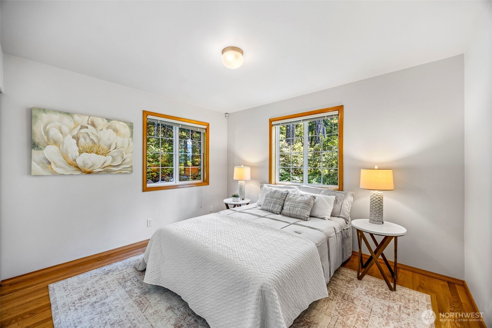 19736 Northwest Stavis Bay Road Seabeck, WA 98380 - Photo 24 of 39 a bedroom with a bed and a window