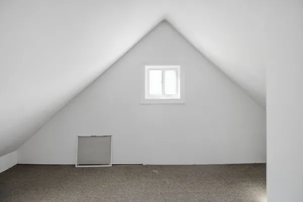 an empty room with wooden floor