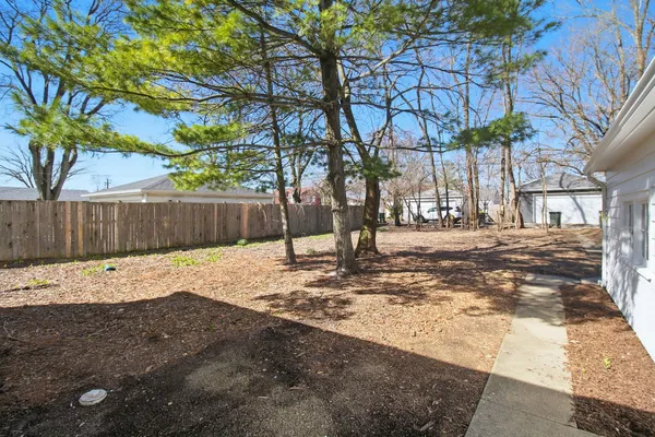 a backyard of a house with lots of green space