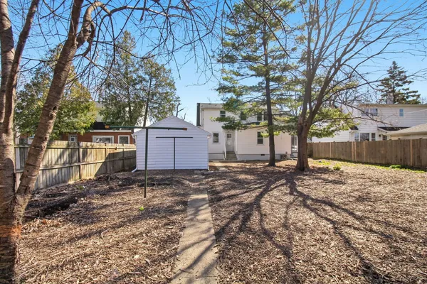 a view of a backyard of the house
