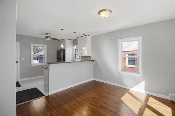 a view of a kitchen with a sink and a window