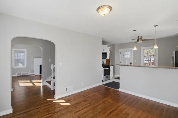 a view of a livingroom with wooden floor