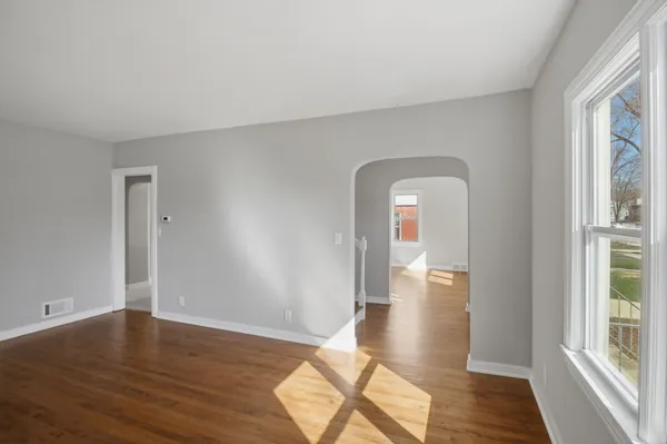 a view of livingroom with hardwood floor and hallway
