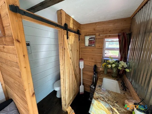 a bathroom with a sink and shower