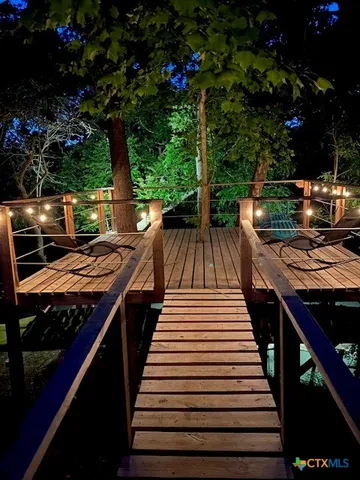a view of a patio with wooden floor and seating space