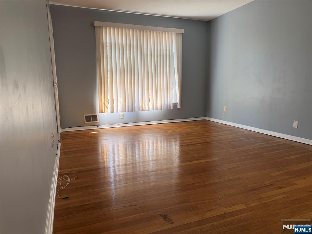 39 Franklin Street, Unit 2 Tenafly, NJ 07670 - Photo 13 of 27 a view of empty room with wooden floor and fan