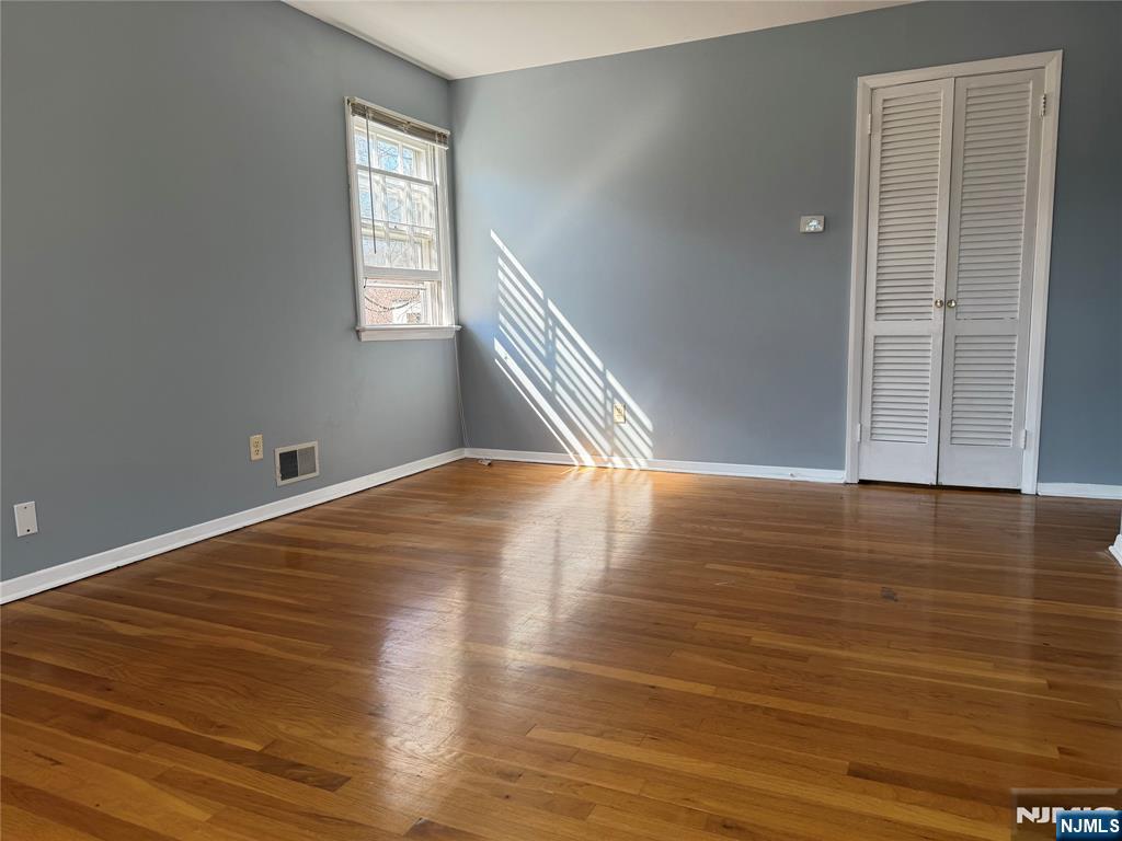 39 Franklin Street, Unit 2 Tenafly, NJ 07670 - Photo 14 of 27 a view of empty room with wooden floor and fan