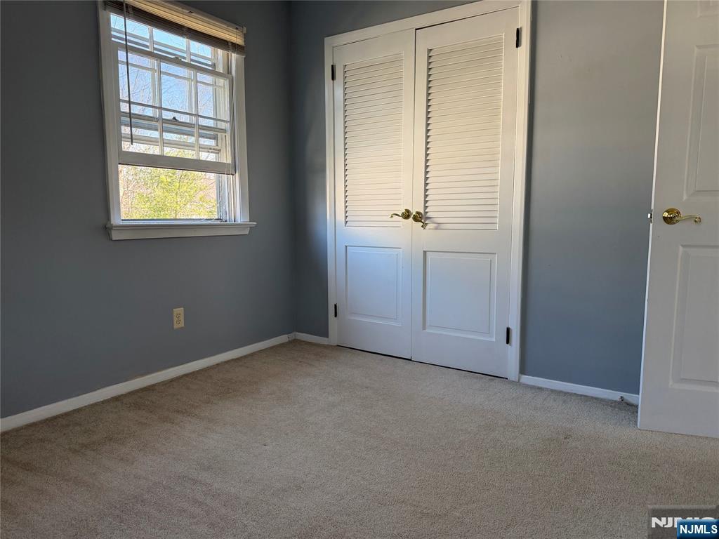 39 Franklin Street, Unit 2 Tenafly, NJ 07670 - Photo 20 of 27 an empty room with windows