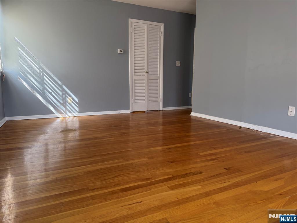 39 Franklin Street, Unit 2 Tenafly, NJ 07670 - Photo 22 of 27 a view of an empty room with wooden floor