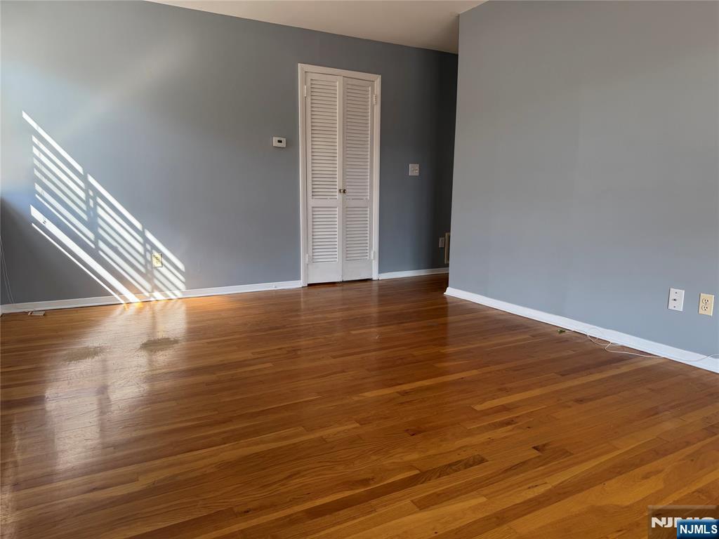 39 Franklin Street, Unit 2 Tenafly, NJ 07670 - Photo 25 of 27 a view of an empty room with wooden floor