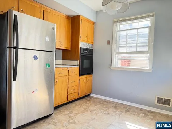a kitchen with a stove and a microwave