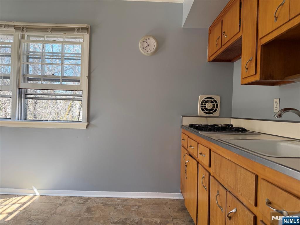 39 Franklin Street, Unit 2 Tenafly, NJ 07670 - Photo 7 of 27 a kitchen with a stove and a microwave