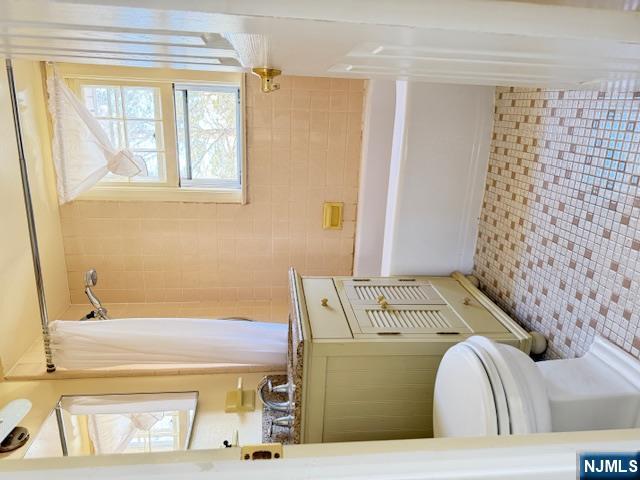 39 Franklin Street, Unit 2 Tenafly, NJ 07670 - Photo 10 of 27 a bathroom with a sink a toilet and a bathtub