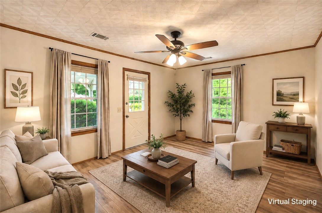 5064 Keowee School Road Seneca, SC 29672 - Photo 9 of 49 This bright living area features abundant natural light, creating an inviting and comfortable atmosphere.