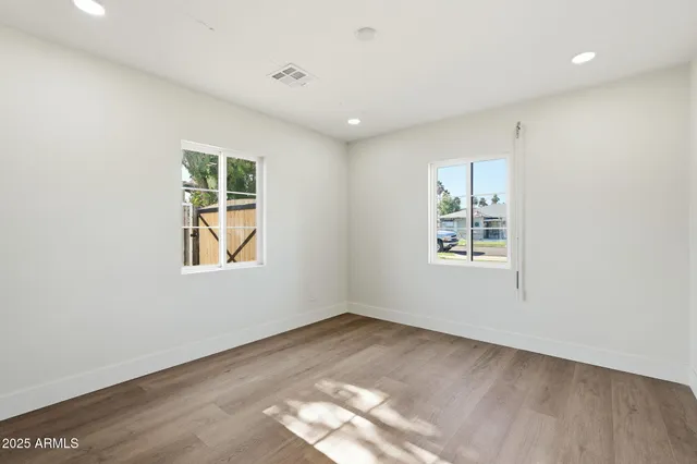 a view of empty room with windows