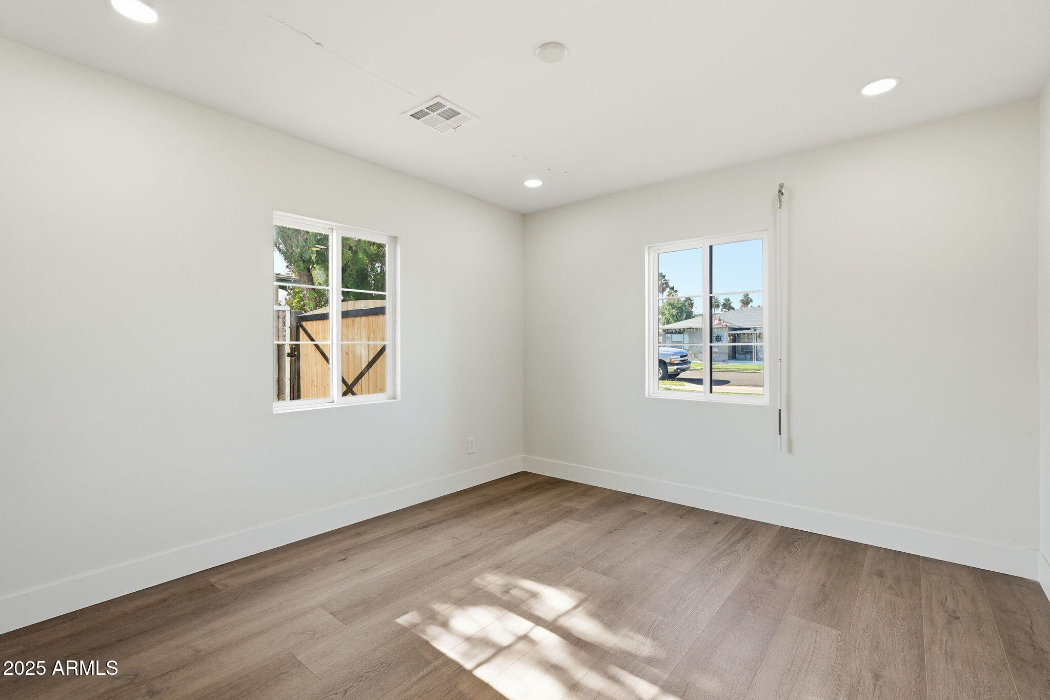 23 North Edgemont Mesa, AZ 85203 - Photo 16 of 25 a view of empty room with windows