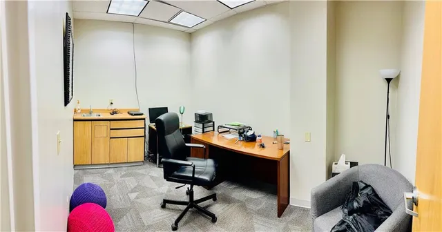 a room with furniture and gym equipment