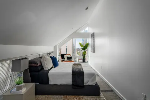 a living room with furniture and a lamp