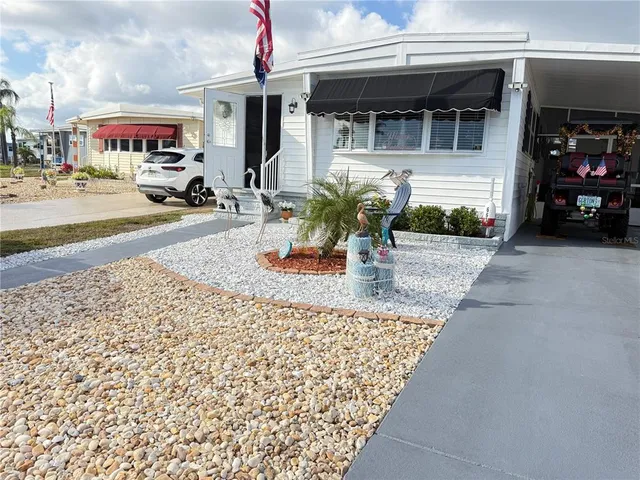 a view of a cars park in front of building