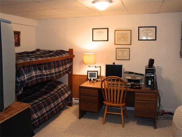 65 Young Road Ashburnham, MA 01430 - Photo 16 of 22 a bedroom with a bed and a chair